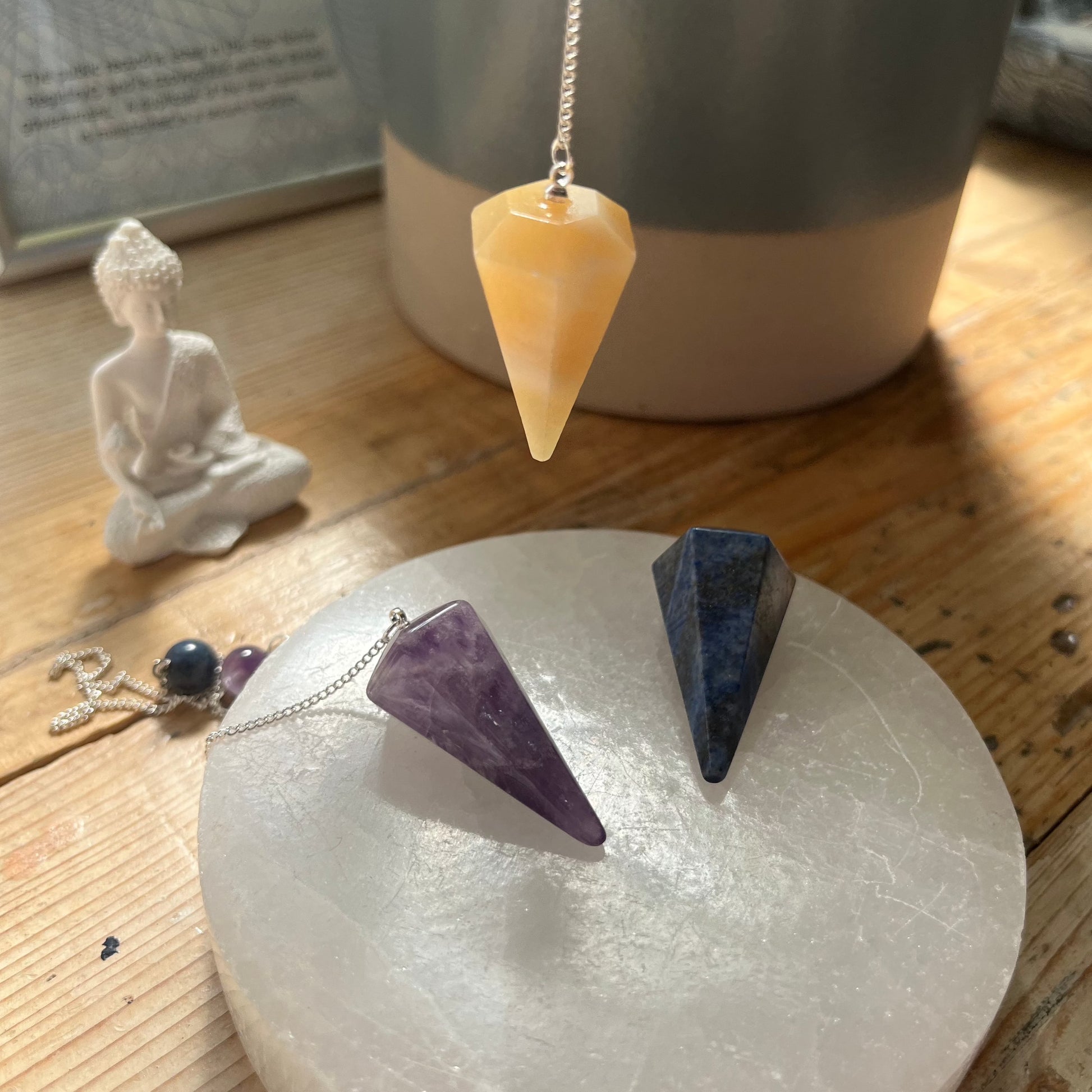 orange calcite crystal pendulum