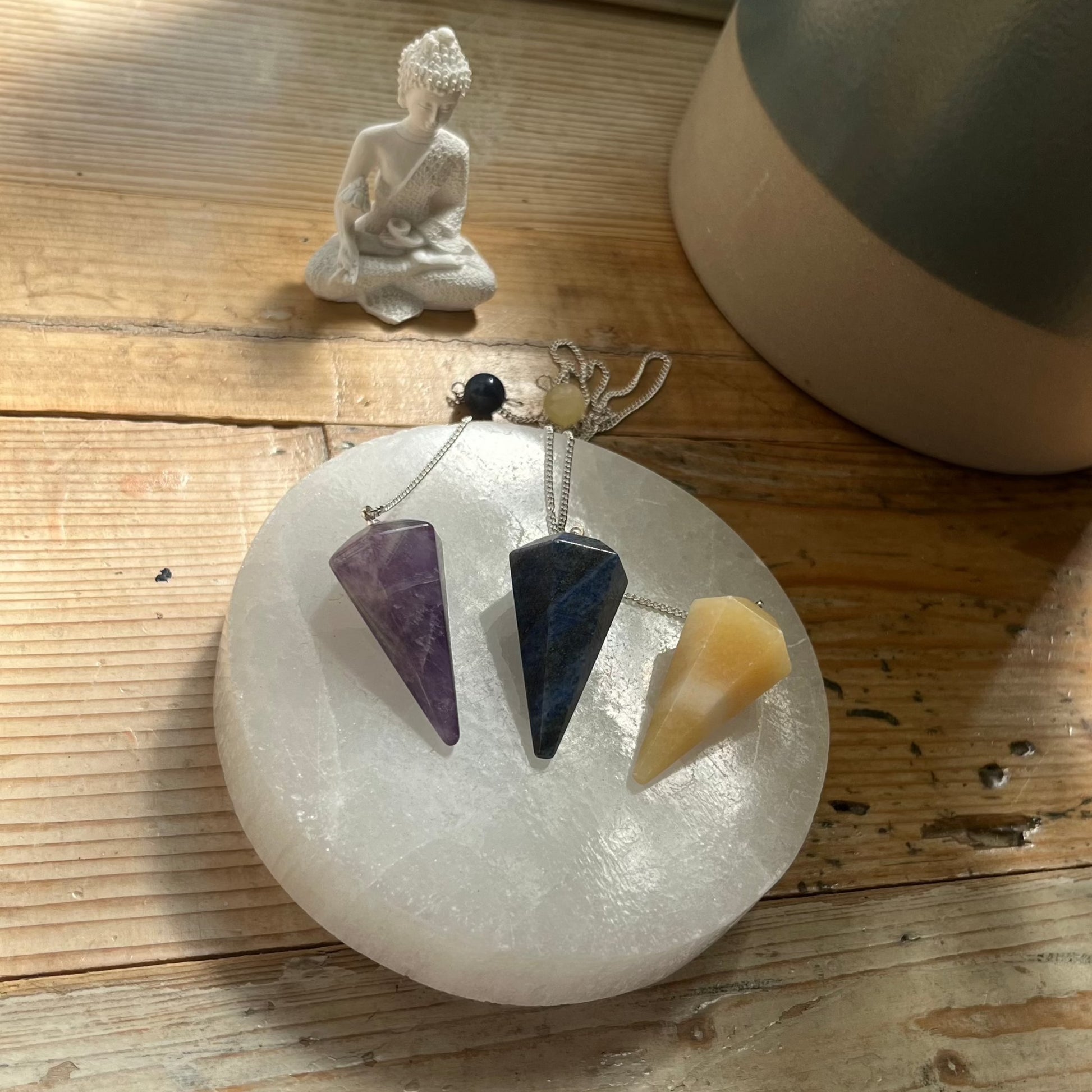 crystal pendulums, amethyst, lapis lazuli, orange calcite